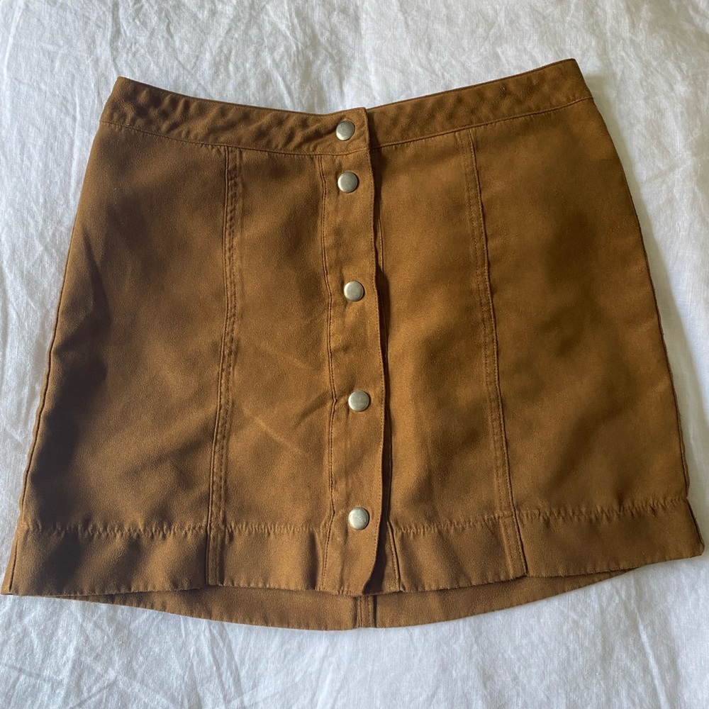 Suede snap button midi skirt — material is 100% polyester.